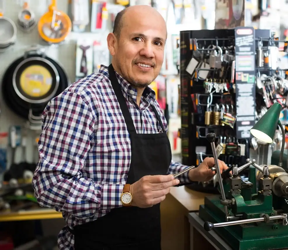 Locksmith working in a key workshop